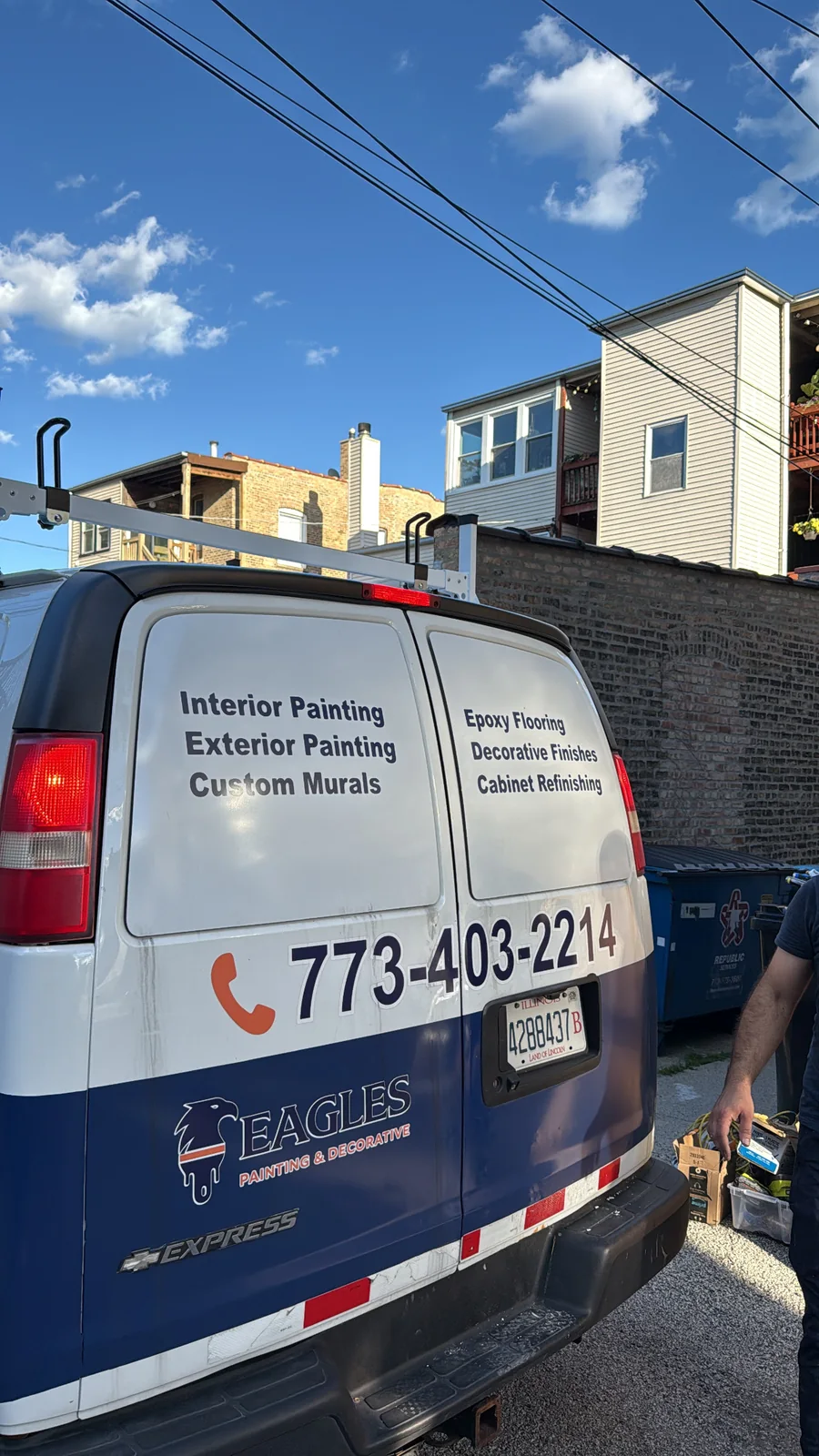 Eagles Painting and Decorative branded service van parked at an active Chicago area project