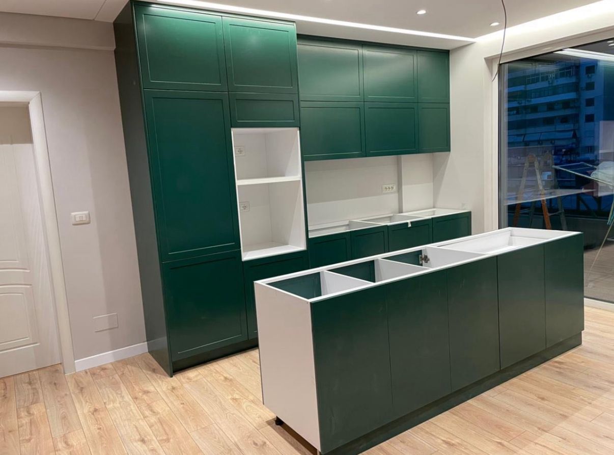 Custom green kitchen cabinets with white countertops